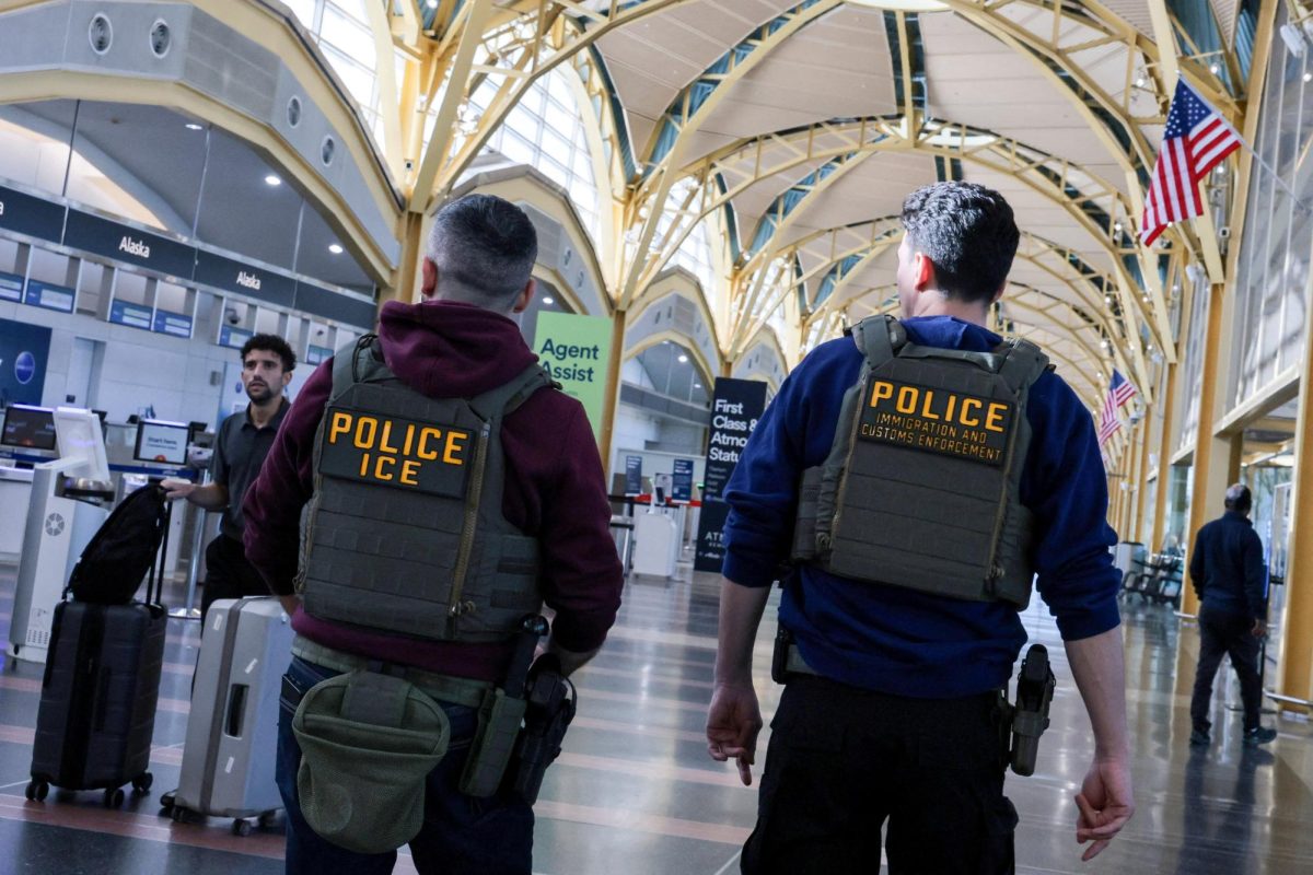 U.S. Immigration and Customs Enforcement (ICE) agents patrol at Washington Reagan National Airport in Arlington, Virginia, U.S., March 24, 2026. REUTERS/Jonathan Ernst